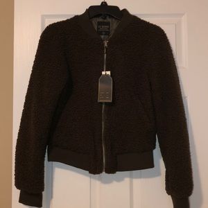 Olive color Faux fur jacket with silver zipper.